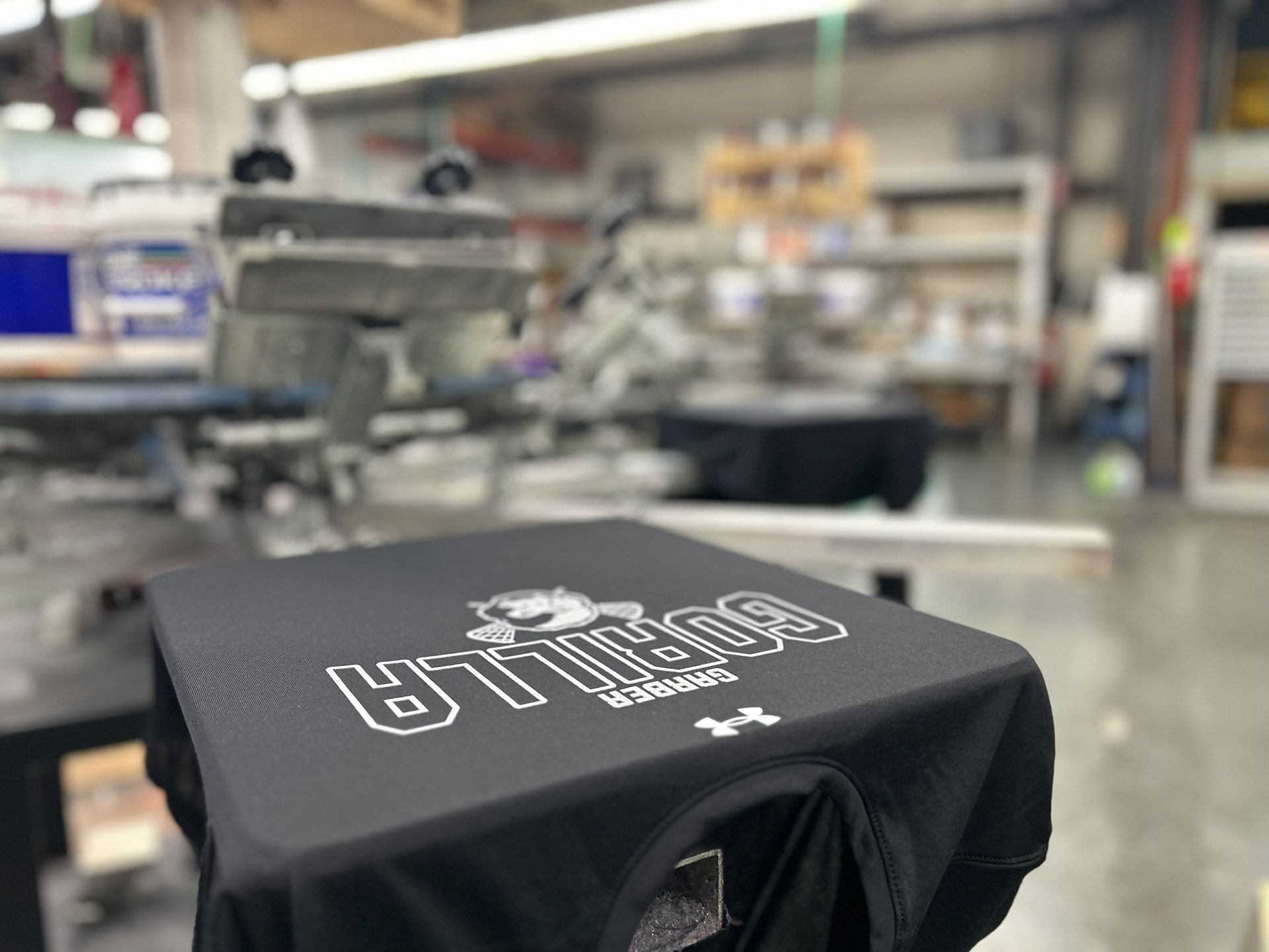 Screen printing custom team apparel at Atlantic Sportswear, Portland Maine